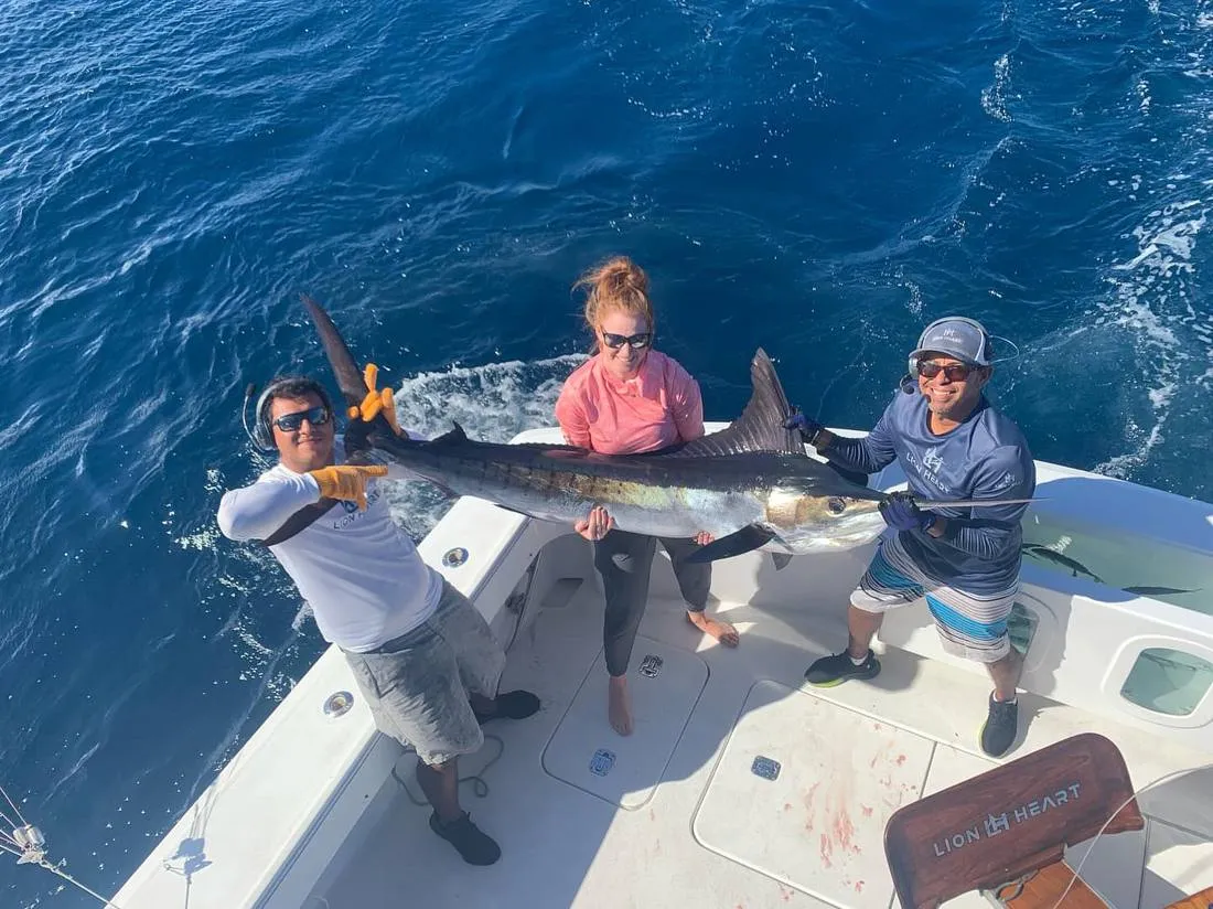 Guest with trophy mahi-mahi dorado on Lion Heart sport fishing charter Cabo San Lucas