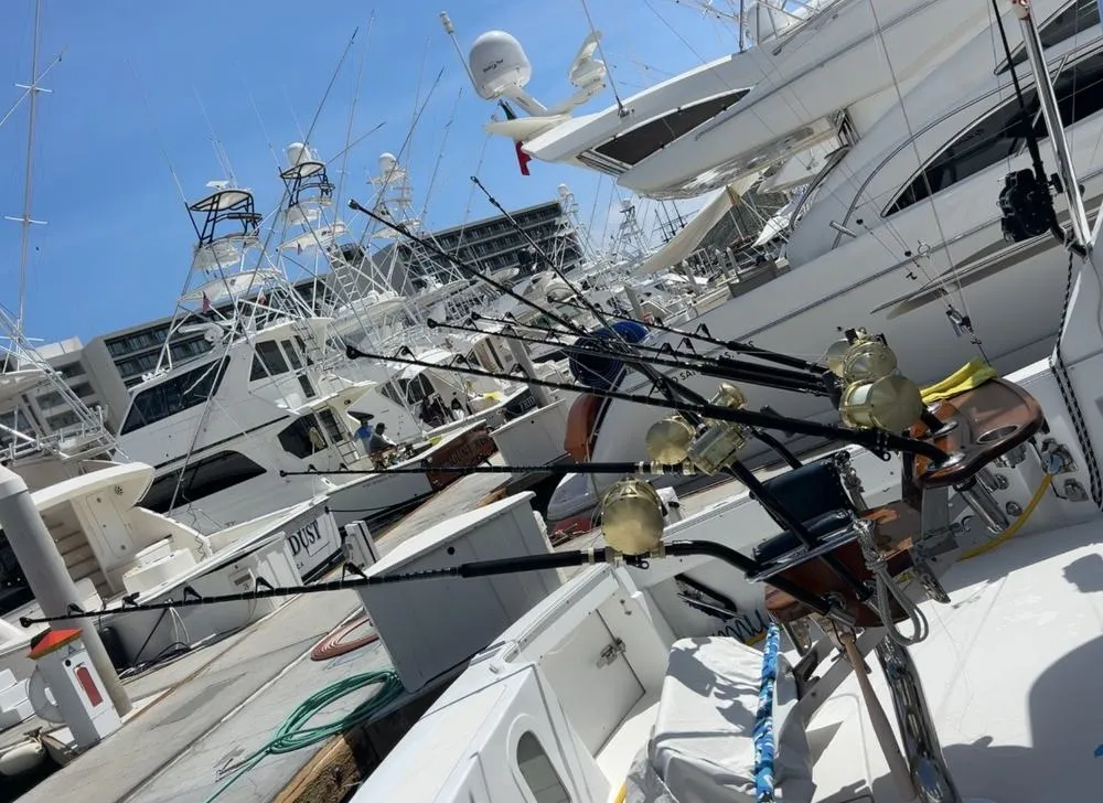 Custom bent butt fishing rods rigged and ready aboard Lion Heart sport fishing charter Cabo San Lucas marina