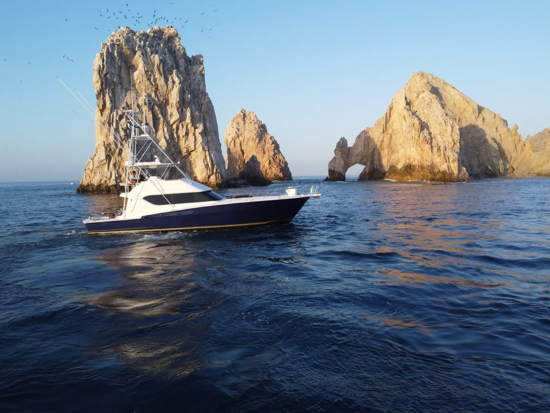Lion Heart 60ft Hatteras sport fishing yacht at the Arch of Cabo San Lucas
