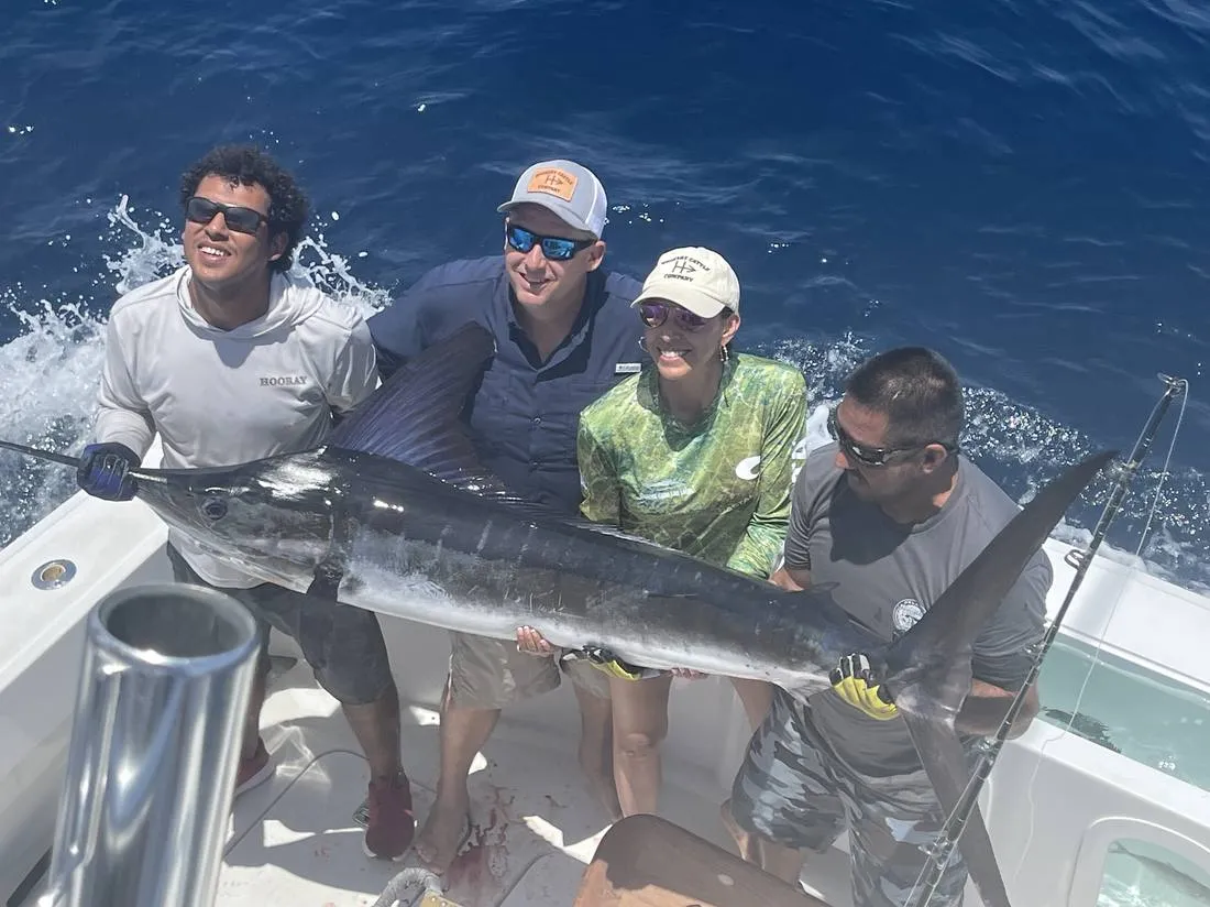 Guests and Lion Heart crew with trophy blue marlin offshore Cabo San Lucas