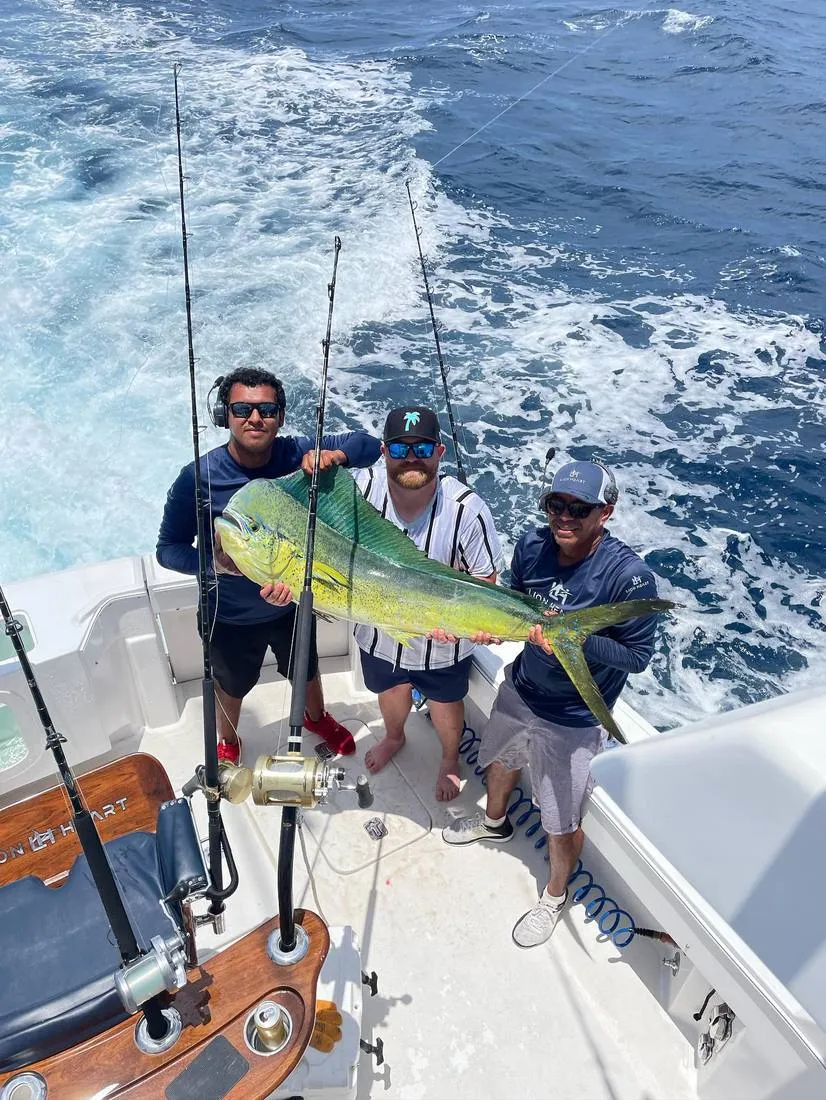 Female angler with striped marlin and Lion Heart crew Cabo San Lucas
