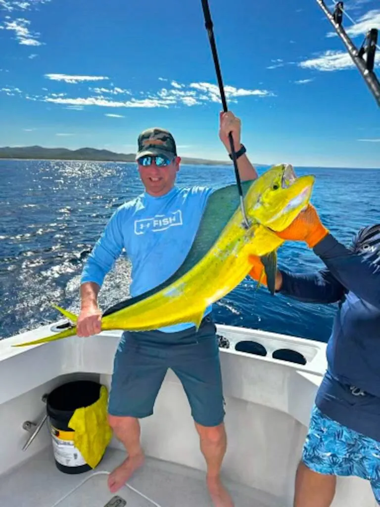 Father and daughter with mahi-mahi on Lion Heart sport fishing Cabo San Lucas