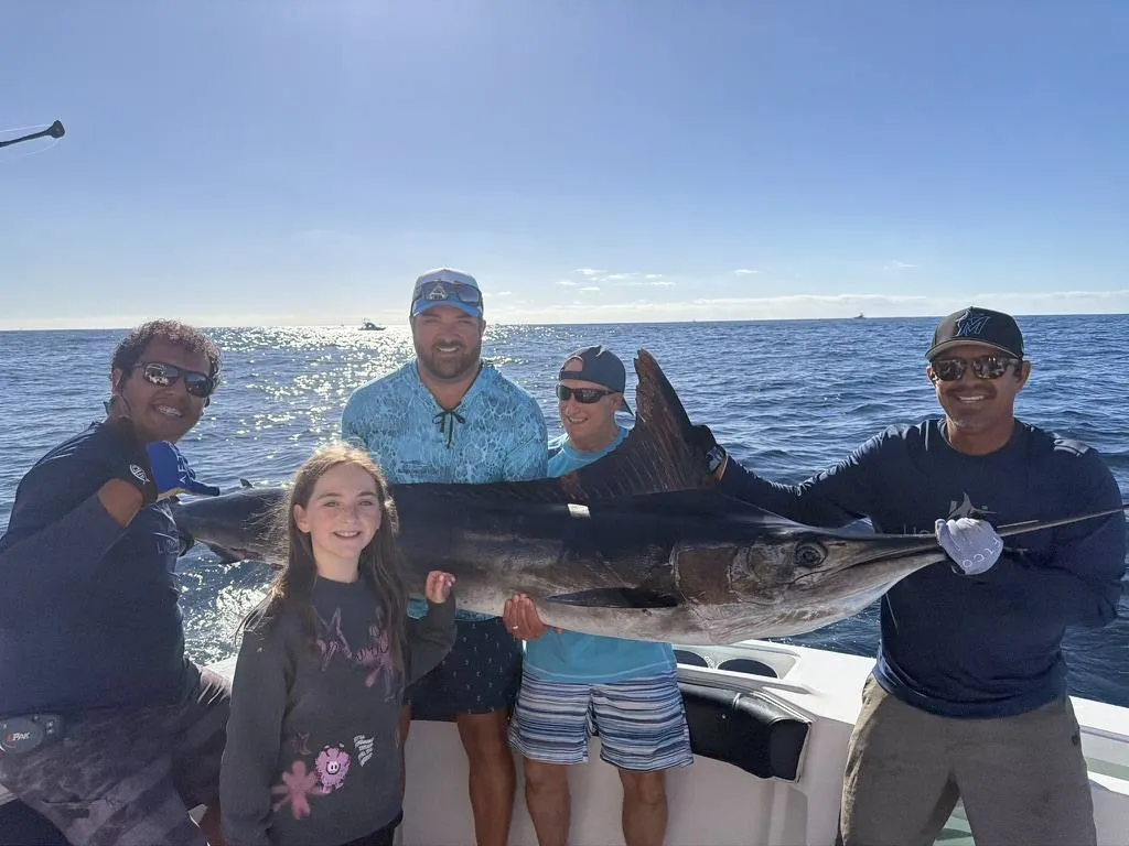 Female angler with yellowfin tuna caught aboard Lion Heart charter Cabo San Lucas